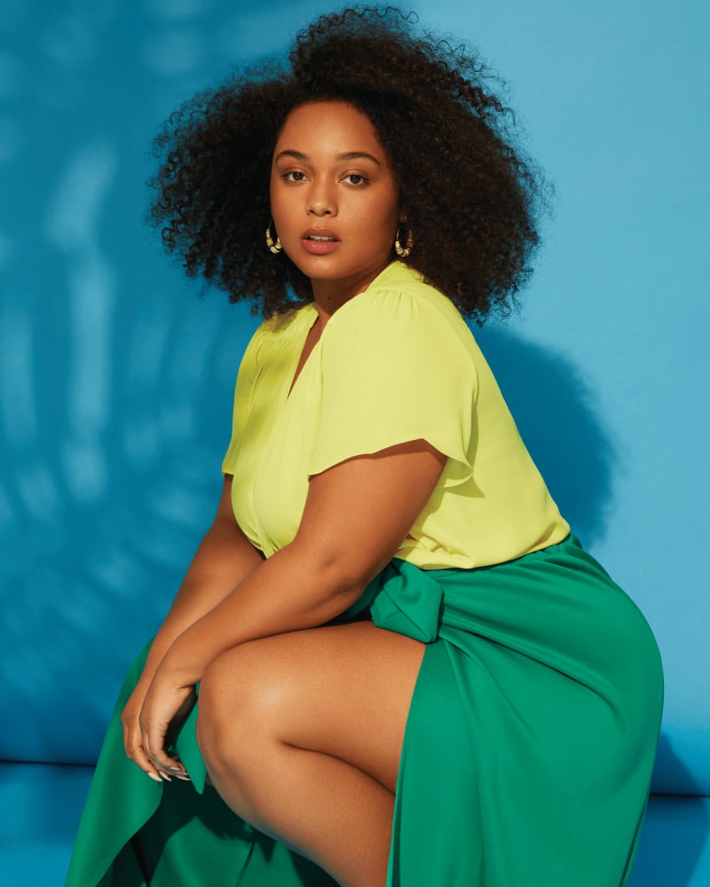 Front of a model wearing a size 1X Lily Flutter Sleeve Blouse in BRIGHT LEMON by Vince Camuto. | dia_product_style_image_id:261662